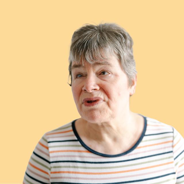 Caroline against a yellow background