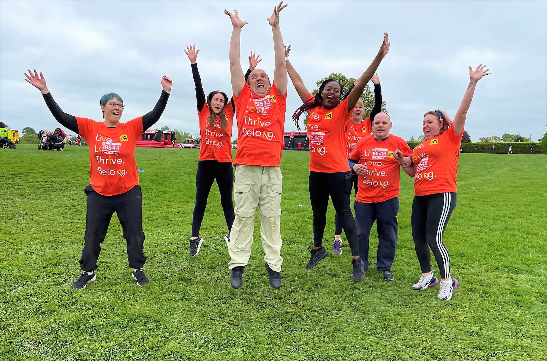 A group of SeeAbility competitors jumping in the air