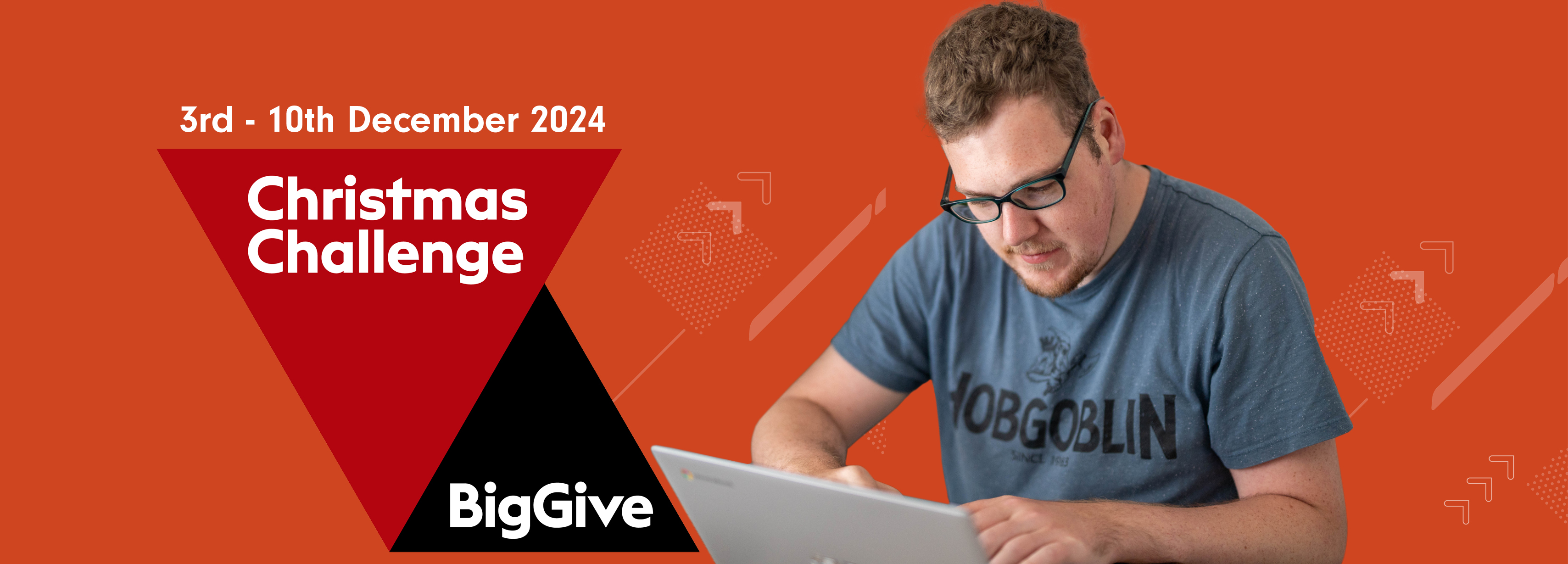 Tim using a laptop. The Big Give logo with text that reads '3rd-10th December 2024'