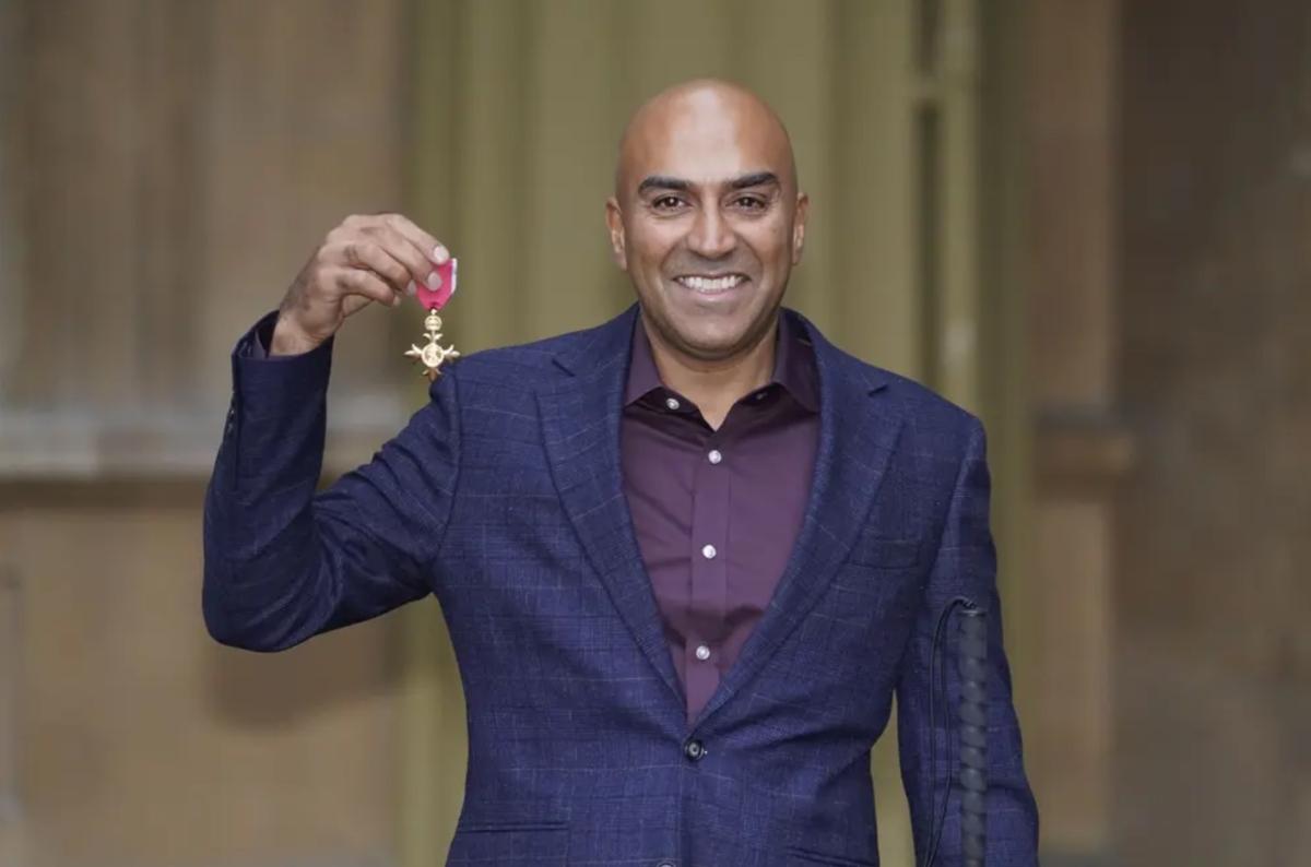 Amar with his OBE 