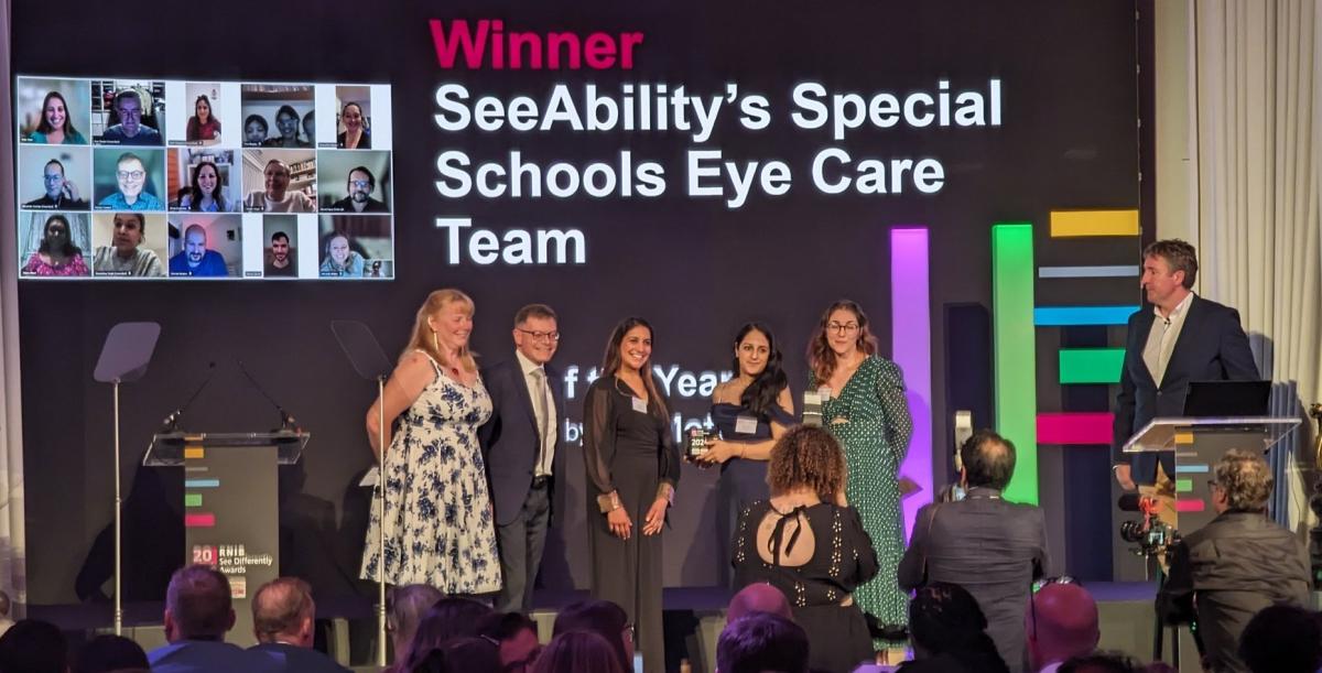 The SeeAbility Eye Care Team on stage with their award