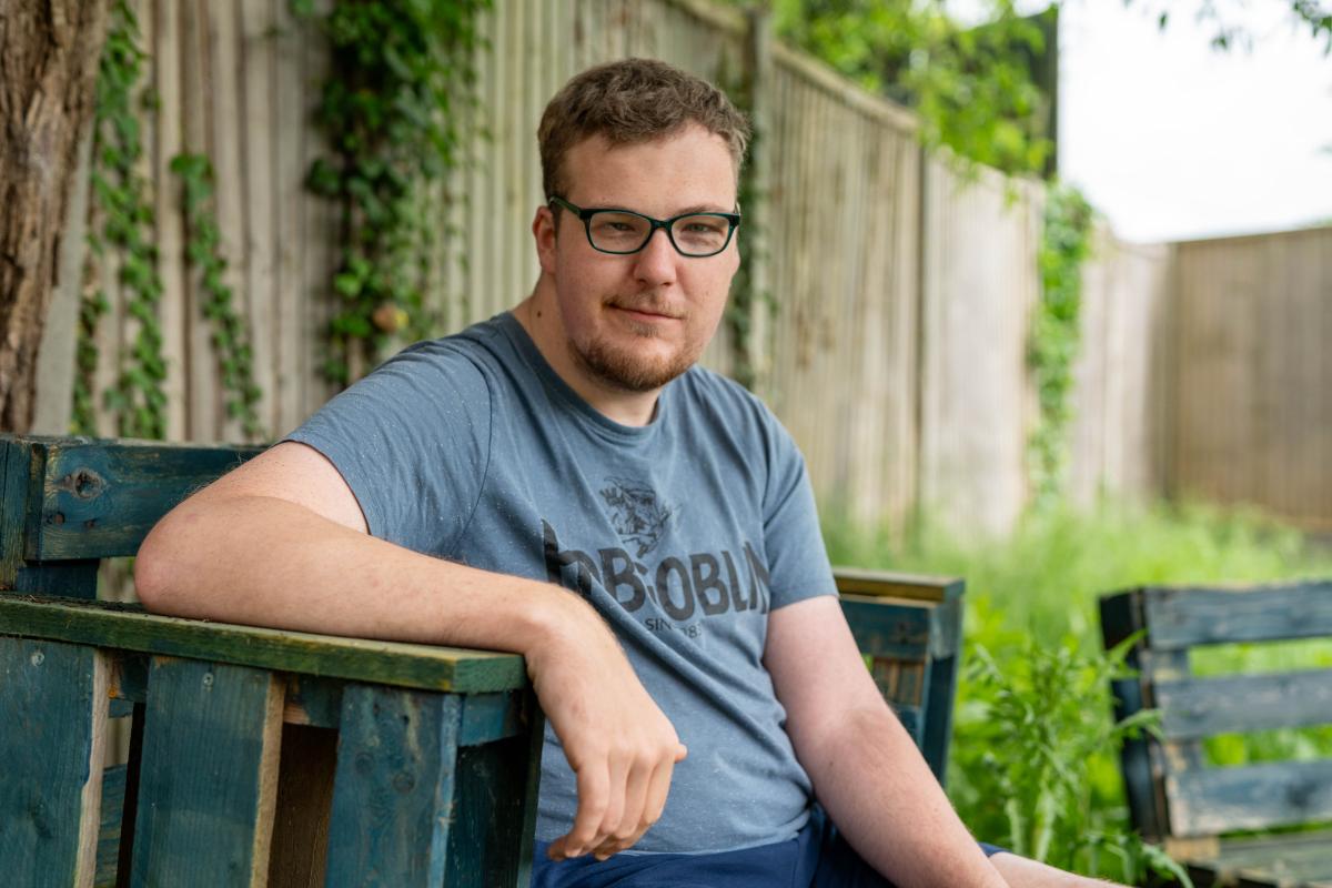 Tim sitting in his garden