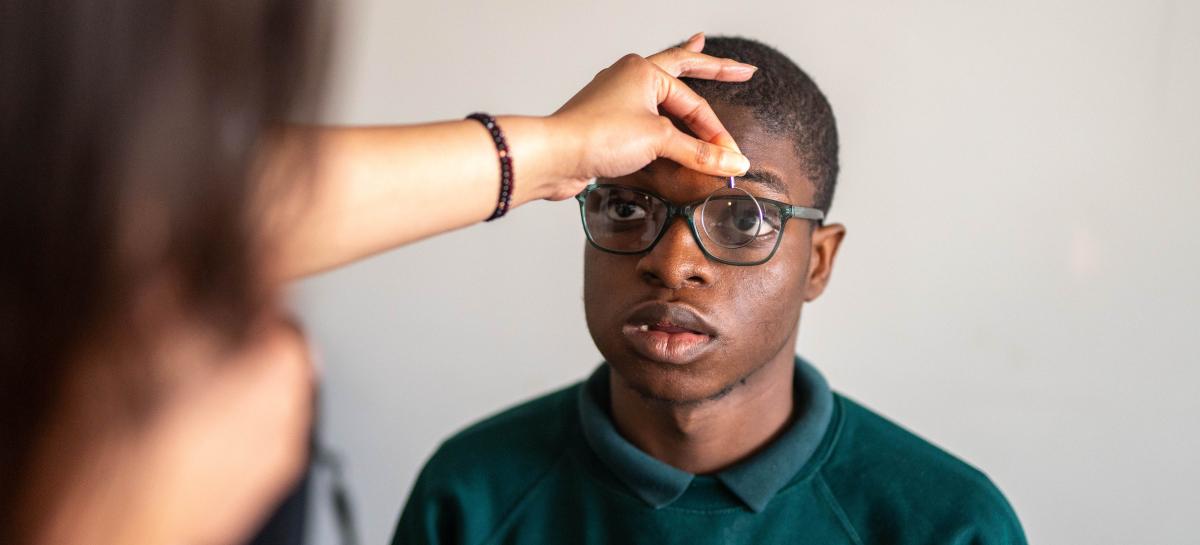 A boy having his eyes tested