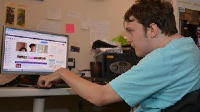 Person on computer at Bristol Support Service