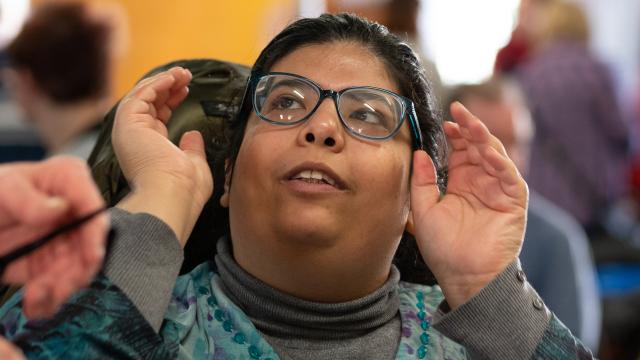 A disabled person wearing glasses