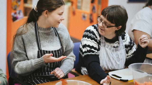 Two people baking cakes at SeeAbility